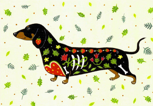 Card with illustration of dachschund decorated with a Day Of The Dead theme surrounded by leaves