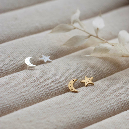 A pair of 9mm moon and star studs etched with tiny constellations. Silver or gold.