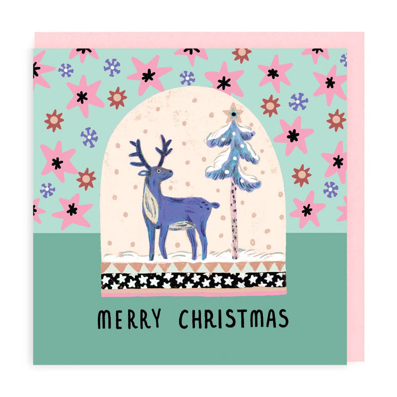 Christmas card with folk art style illustration of a deer next to a snowy tree