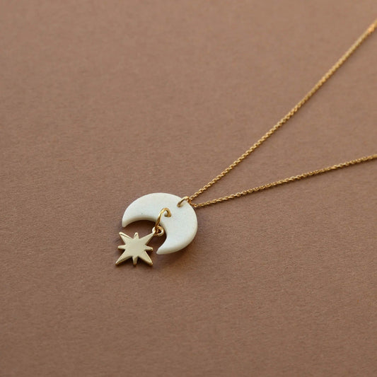 Gold chain necklace with white crescent moon and gold star