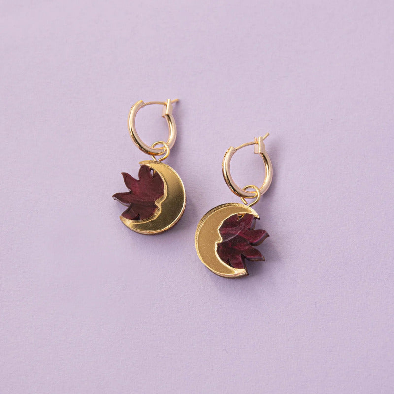 Small gold hoop earrings with gold crescent moon and dark red sun