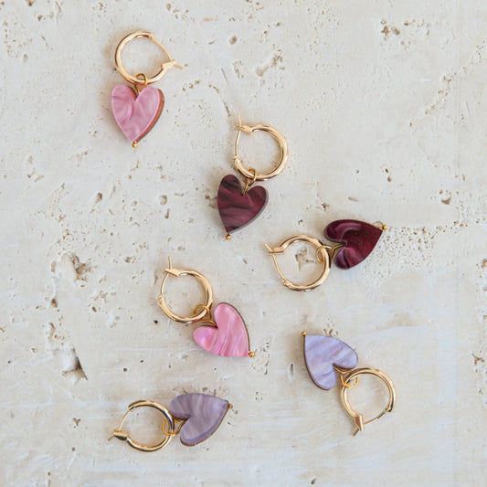 Small gold hoop earrings with coloured marble heart. Available in red, pink and lilac