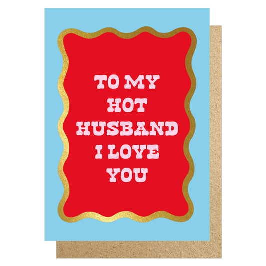 Greeting card with red text 'TO MY HOT HUSBAND I LOVE YOU' on a blue background