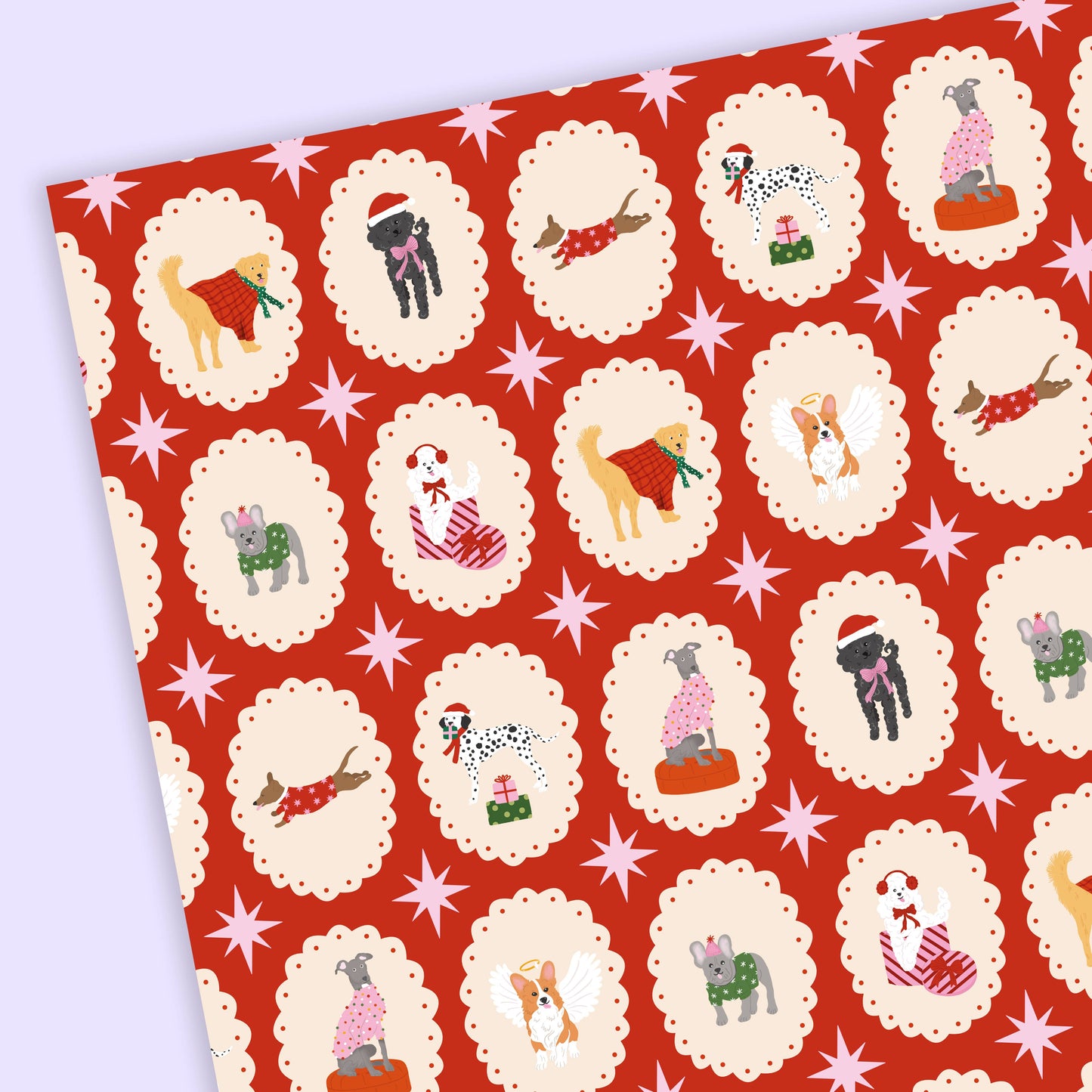 Red wrapping paper with dog illustrations and decorative stars on a white background