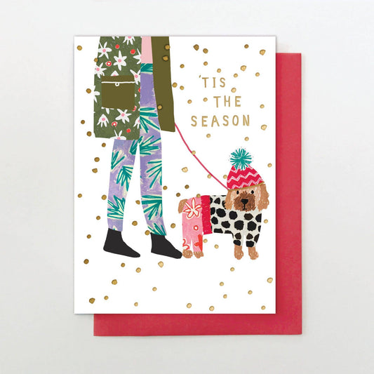 Greeting card with illustration of a person and dog, featuring 'Tis the Season text.