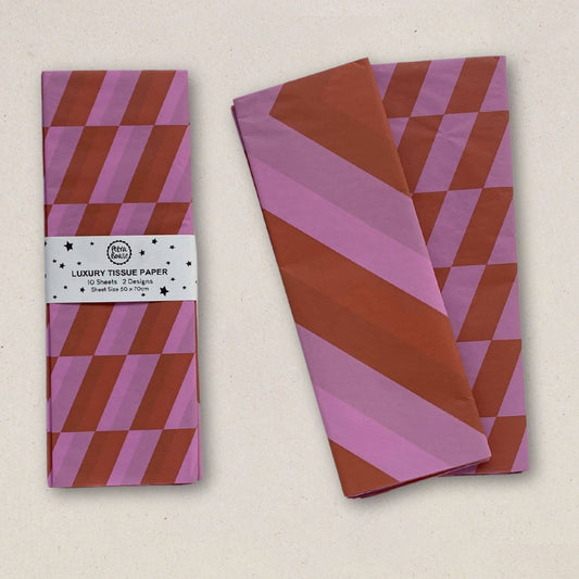 Luxury tissue paper with pink and brown striped design on a beige background