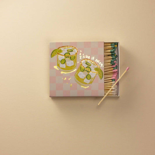 Matchbox with matchsticks on a beige background