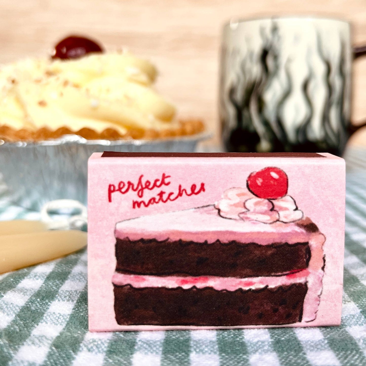 Box of matches with a picture of a cake text ready perfect matches