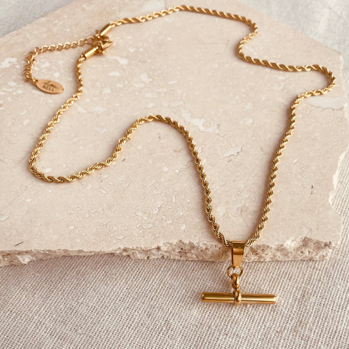 Gold plated bar pendant on a twisted chain.