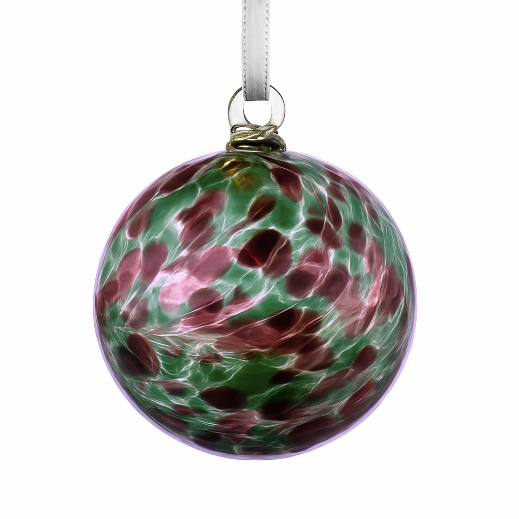 Bauble with ribbon hanging against a white background.