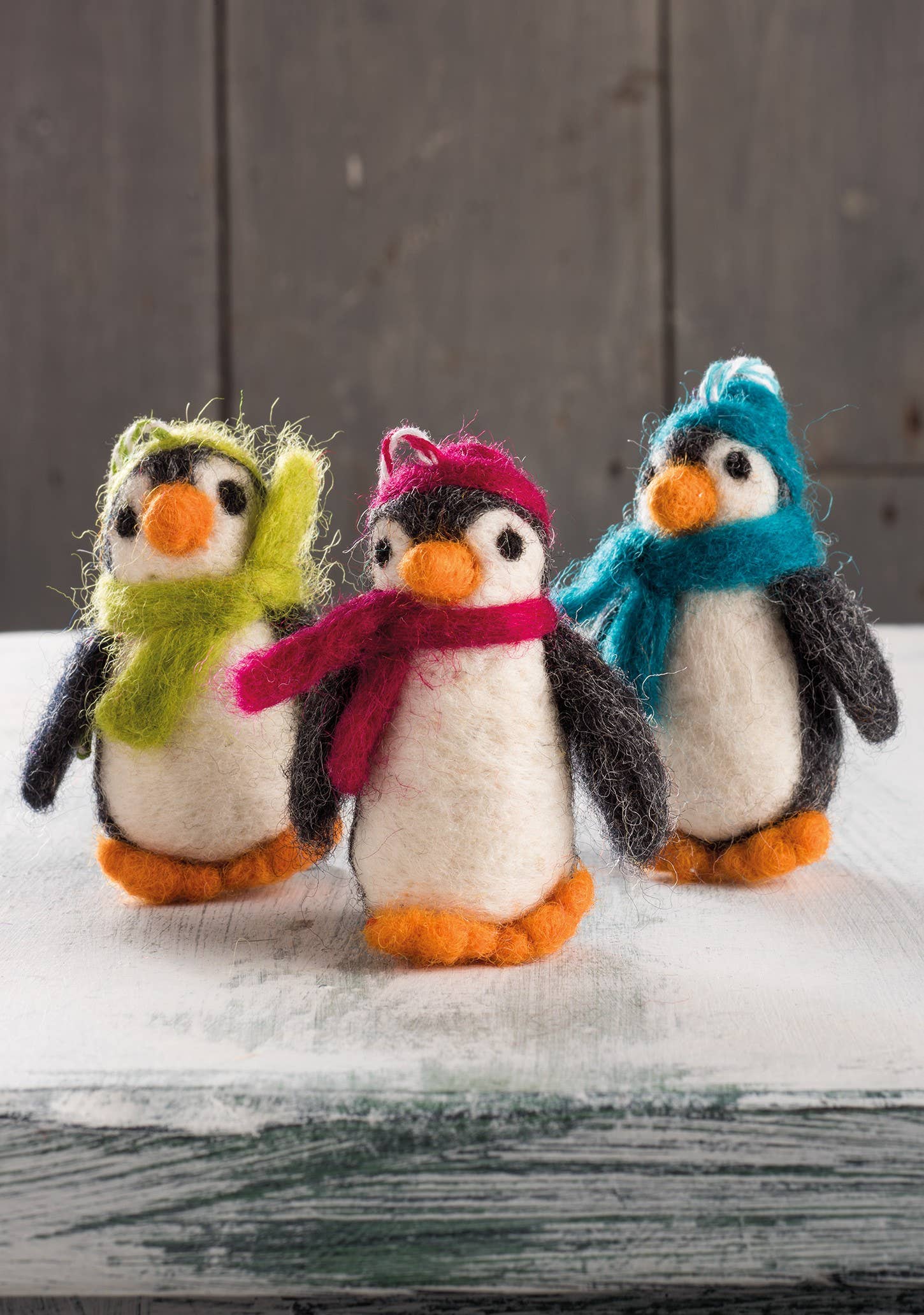 Set of 5 Felted penguins with hats and scarves.