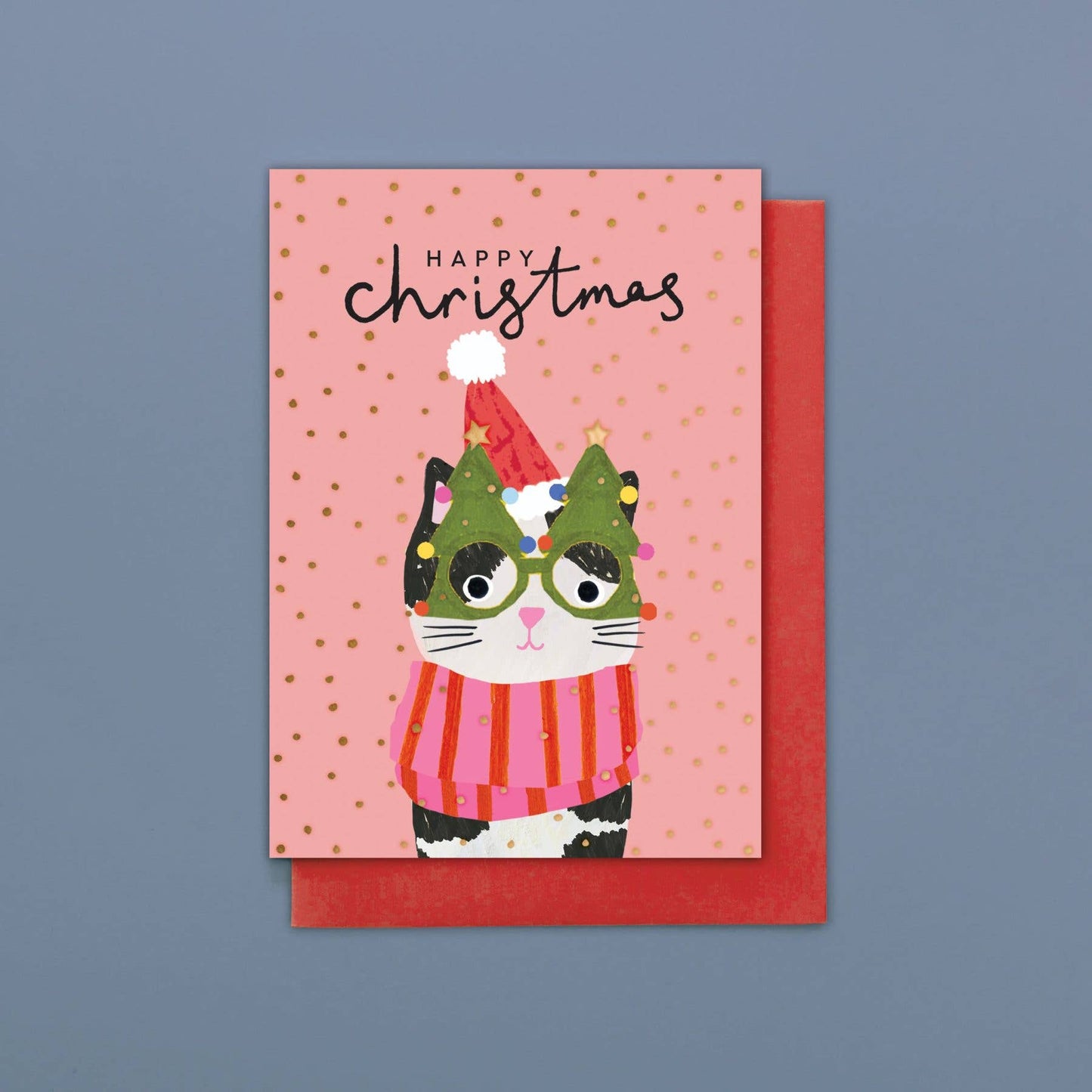 Christmas card with a cat illustration wearing a Santa hat and striped sweater on a pink background.