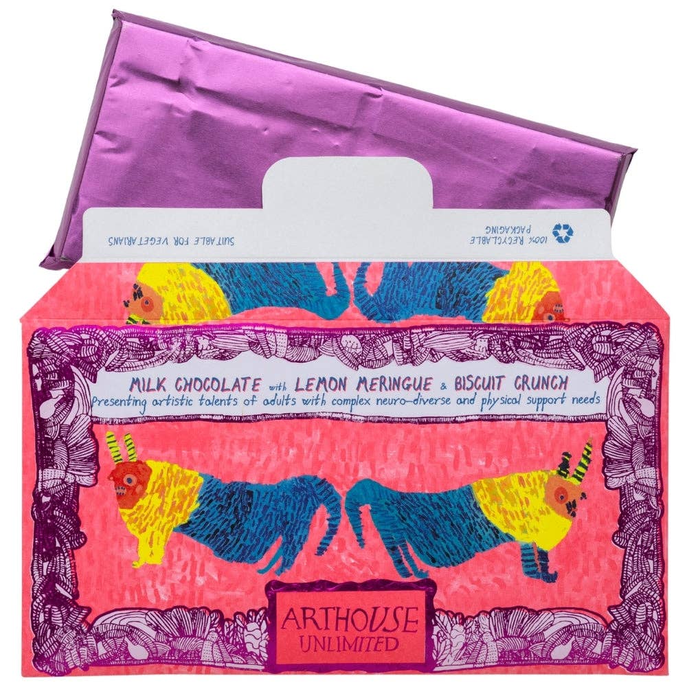 A box of Arthouse Unlimited milk chocolate with lemon meringue and biscuit crunch, featuring a vibrant pink and purple illustrated design with stylized figures on the front and a purple lid propped behind it.