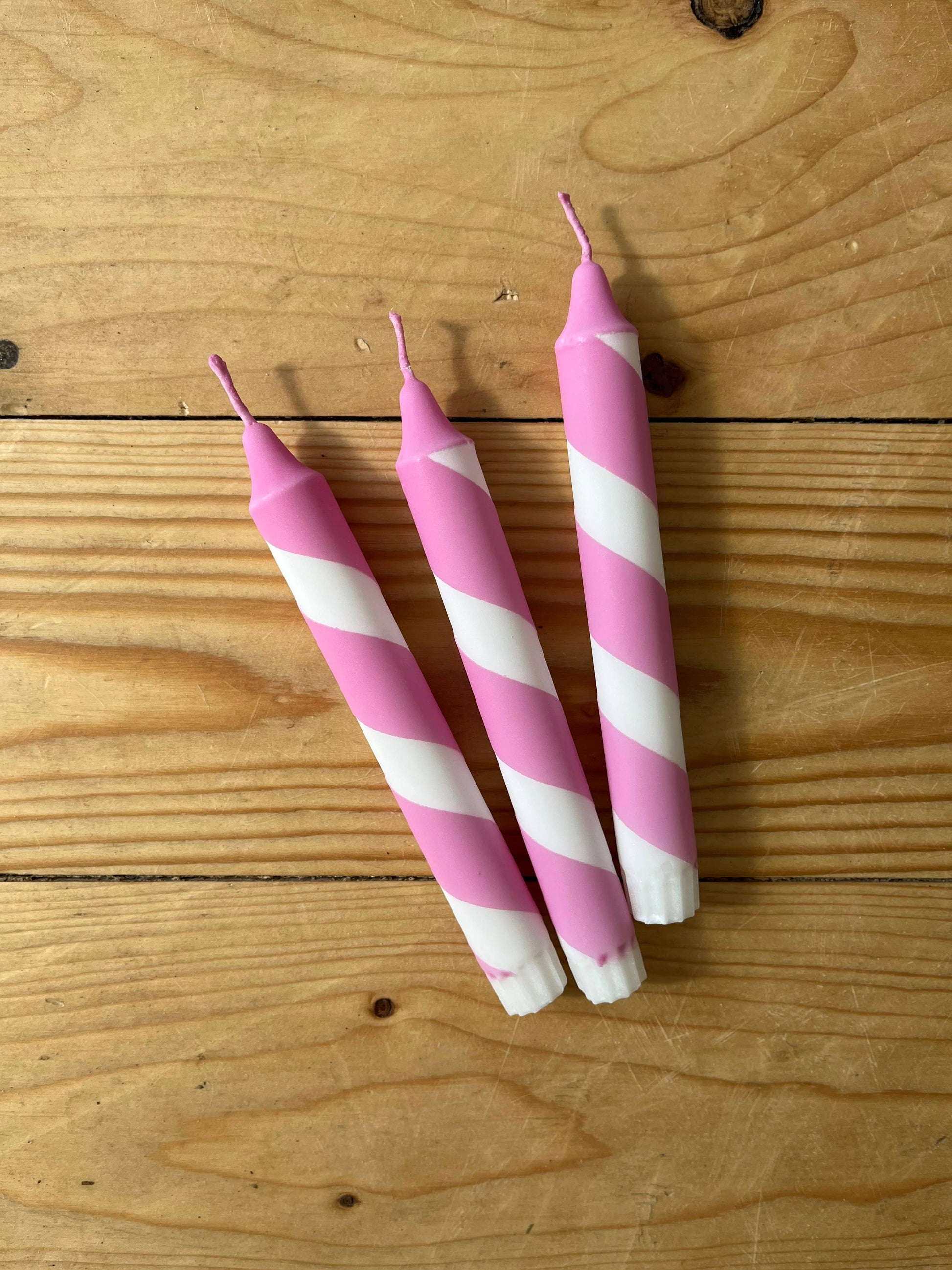 Rose pink and white heater skelter table candle.