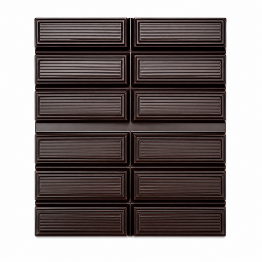A dark chocolate bar with a grid pattern of twelve rectangular sections, each with horizontal ridges, set against a solid white background.