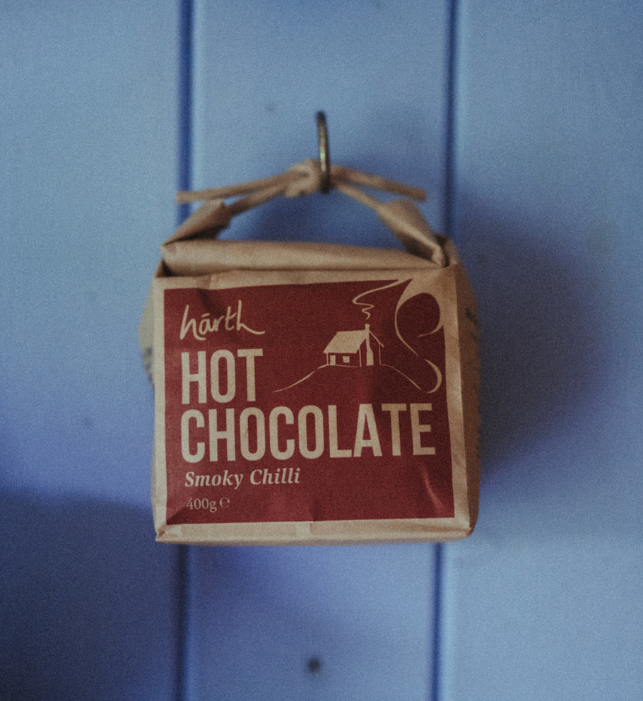 Box of HARTH Hot Chocolate Smoky Chilli on a blue background