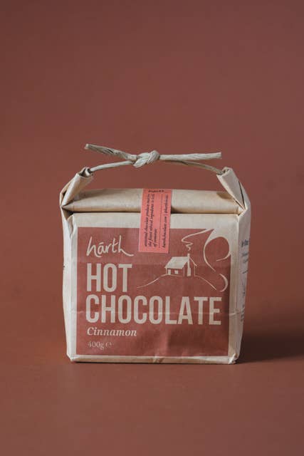 Box of Harth Hot Chocolate Cinnamon on a brown background