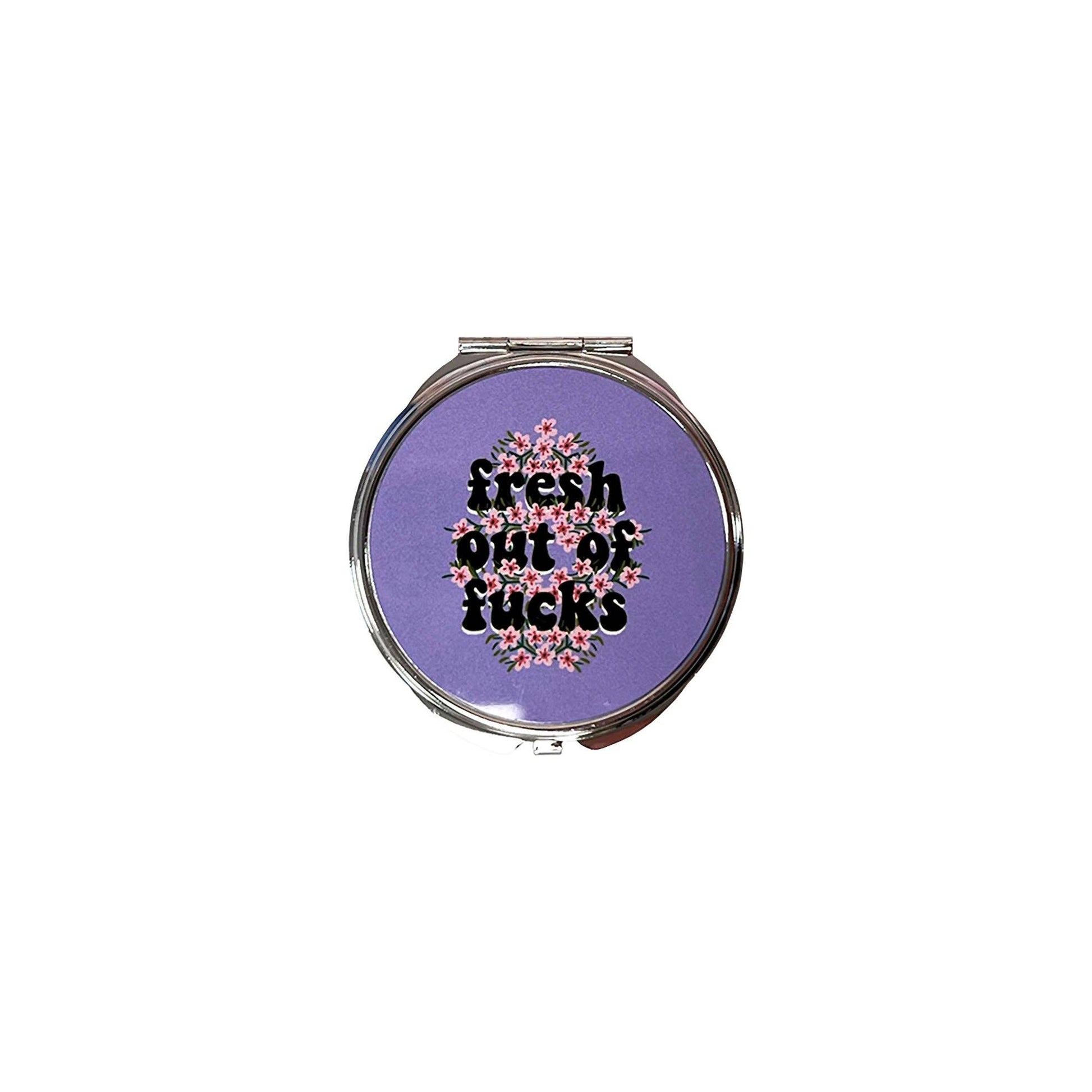 Small mirror compact with the words Fresh out of Fucks.