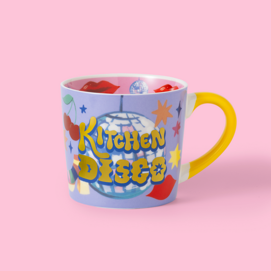 Colorful mug with 'Kitchen Disco' text on a pink background