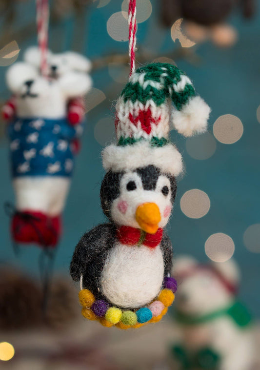 Felted Penguin with a giant wooly hat on.