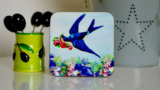 Swallow with flowers on a coaster