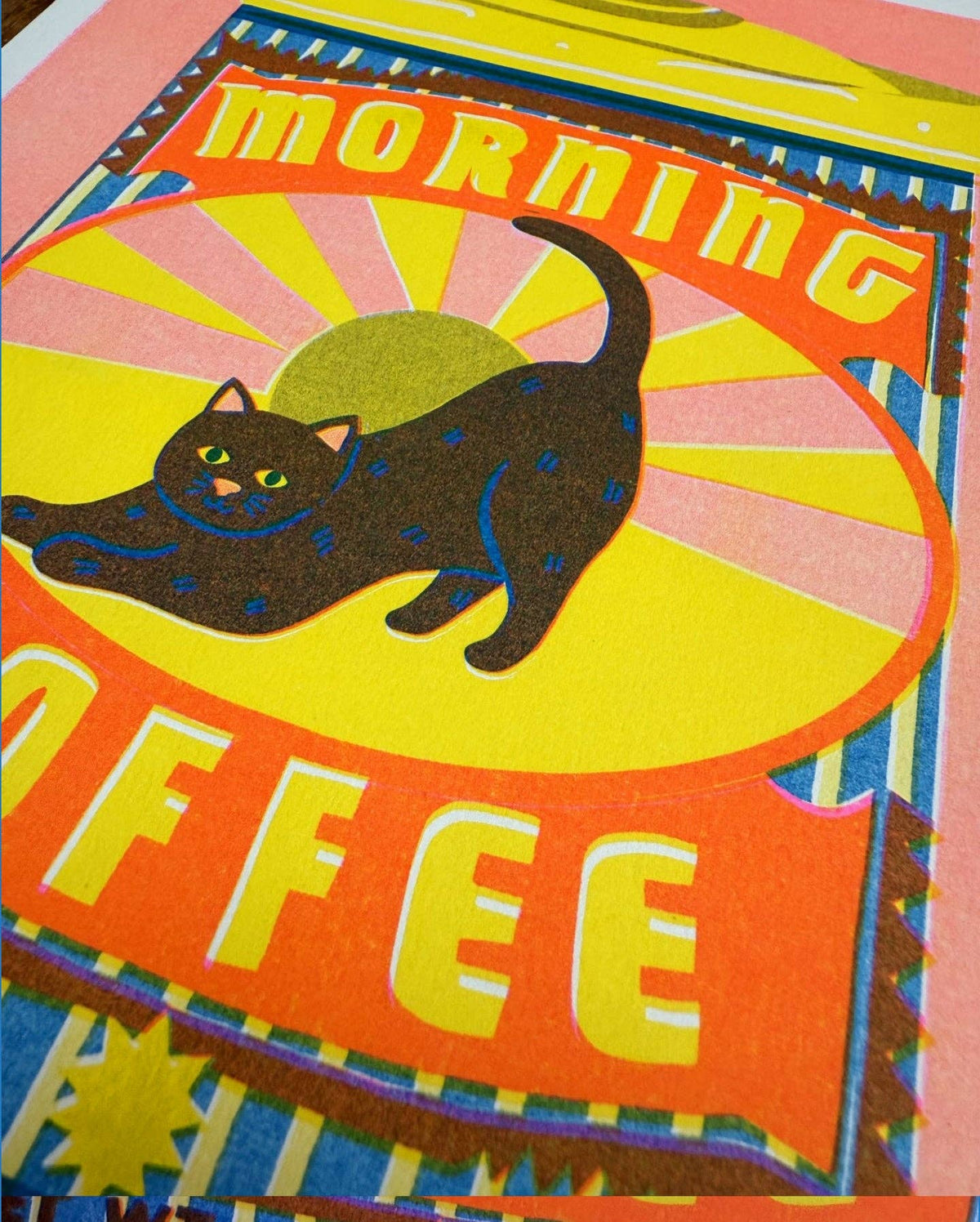 Colorful poster with a black cat and 'Morning Coffee' text on a yellow background