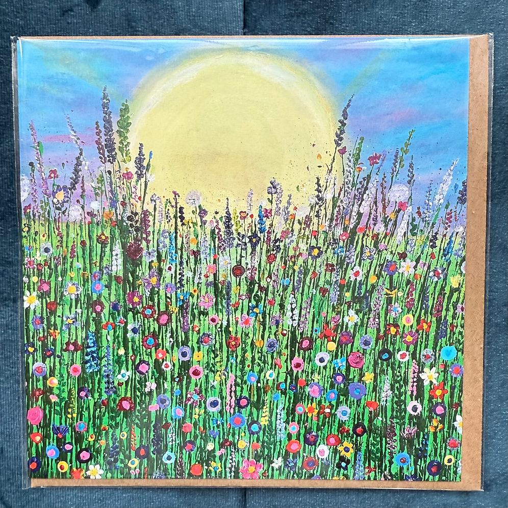 A square card featuring a hand-painted scene of wildflowers, with a large sun in the background.