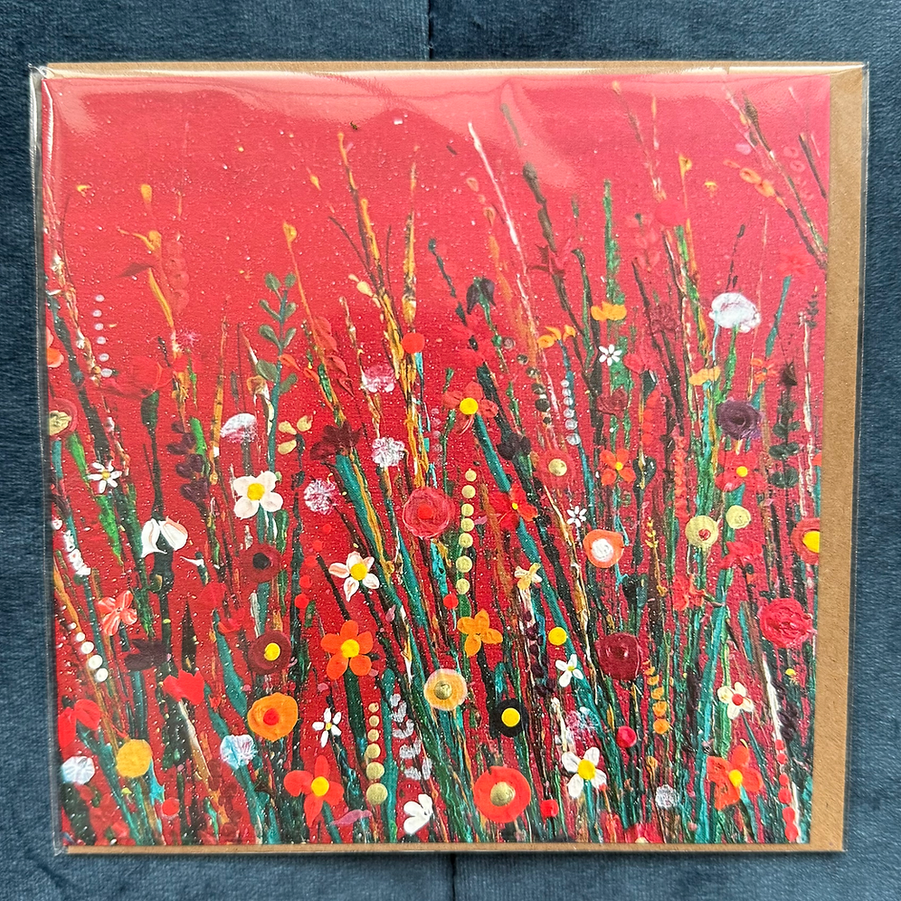A square card featuring a vibrant red background with colourful painted flowers.