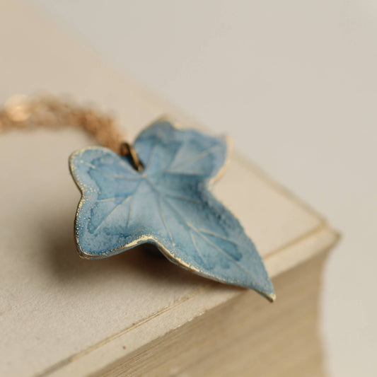 Blue butterfly-shaped object on a wooden surface