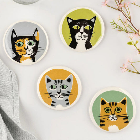 Set of four coasters with folk art designs of four different cheeky cats