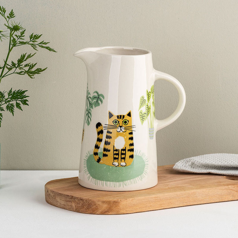 Tall ceramic jug, holds 2 pints is decorated with 2 cats sitting amongst foliage.