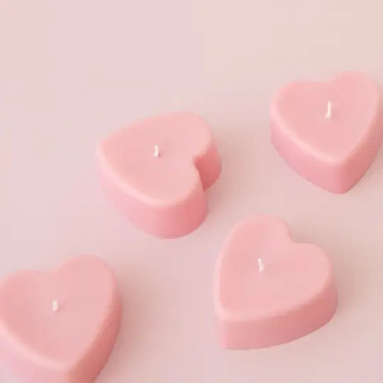 Handpoured pastel pink soy wax love heart candle.