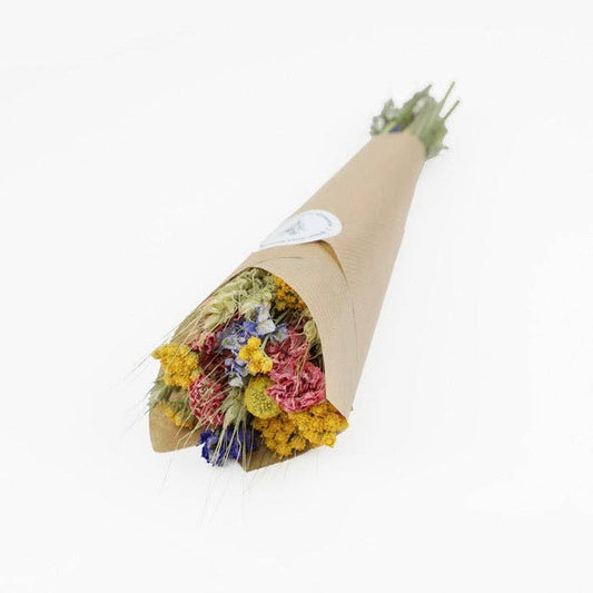 Bouquet of flowers wrapped in brown paper on a white background