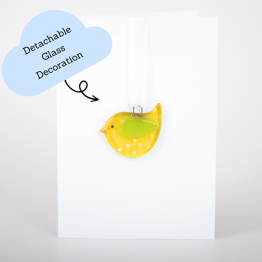 Yellow bird-shaped glass decoration with detachable glass on a white background