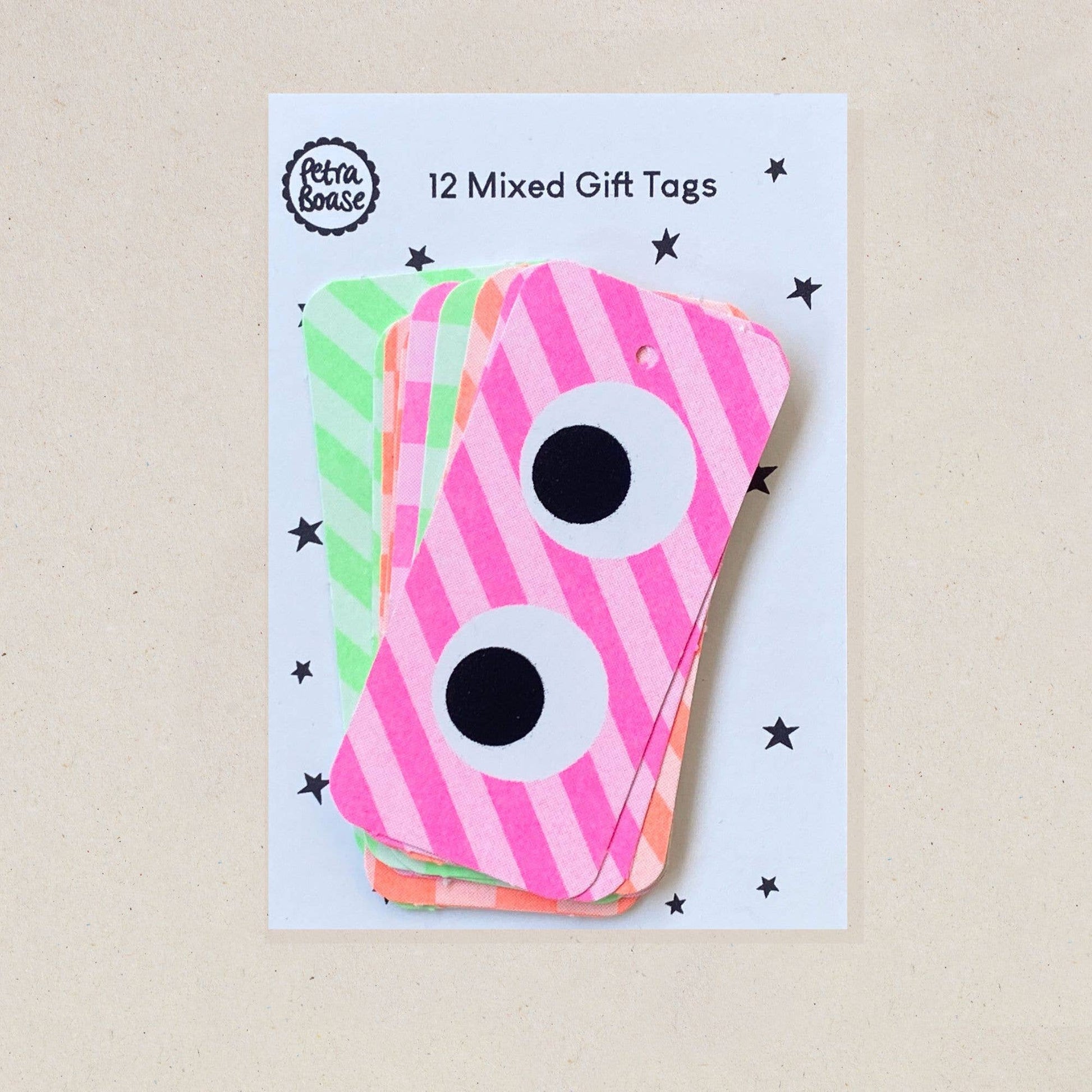 Pack of mixed gift tags with pink and green stripes on a beige background