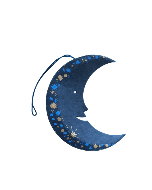 Blue crescent moon-shaped ornament with star patterns on a white background