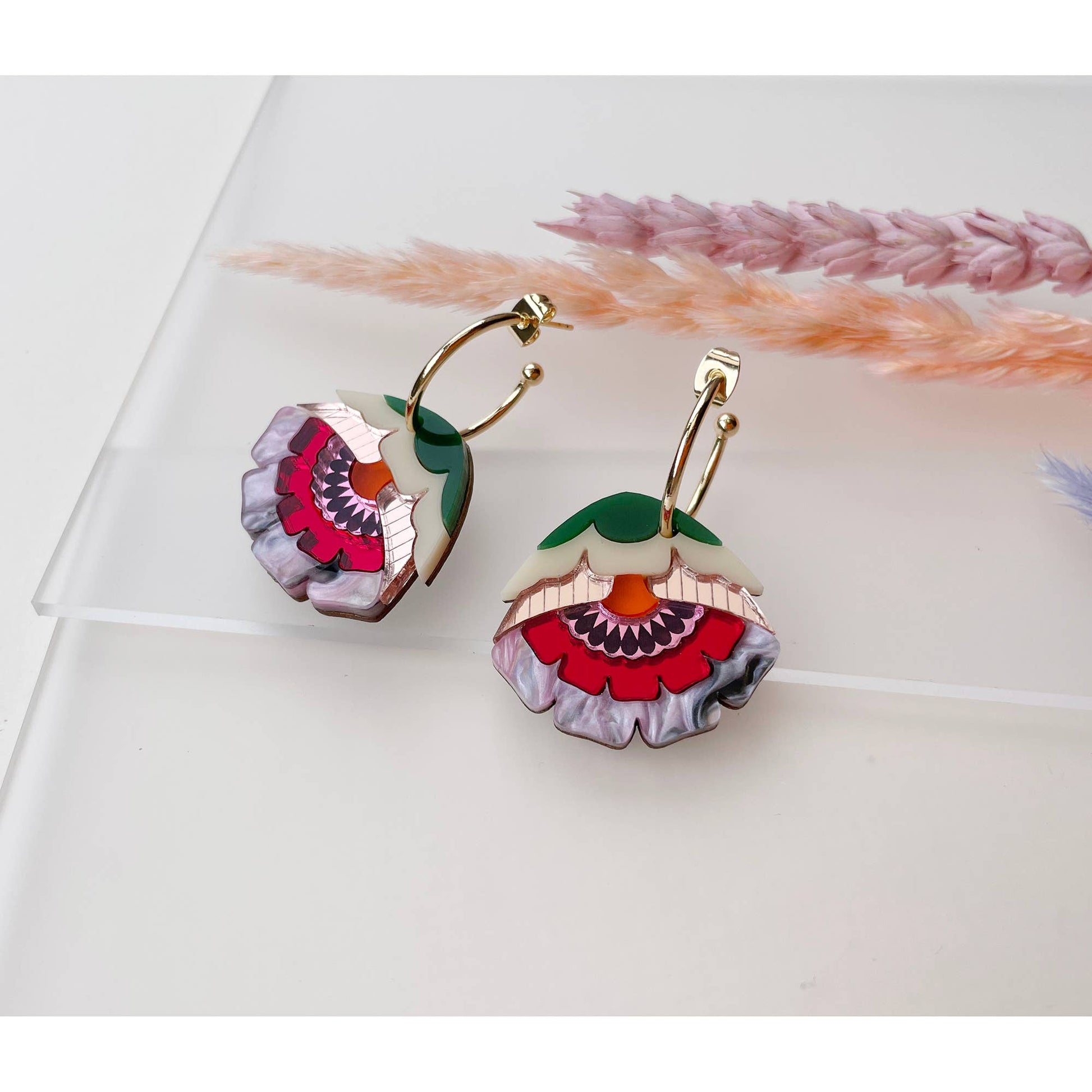 Floral earrings on a light background
