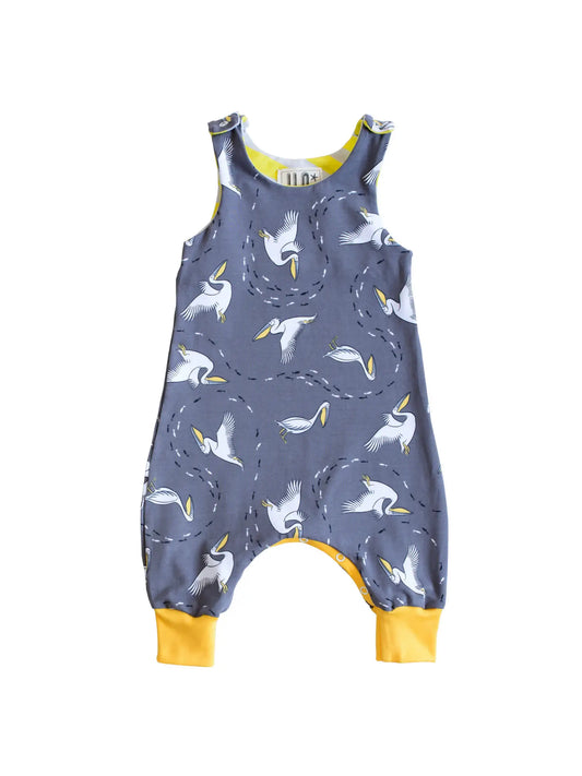 Sleeveless Romper with adjustable poppers as baby grows.  Fabric design with pelicans on a grey background.  Designed in Bristol. 