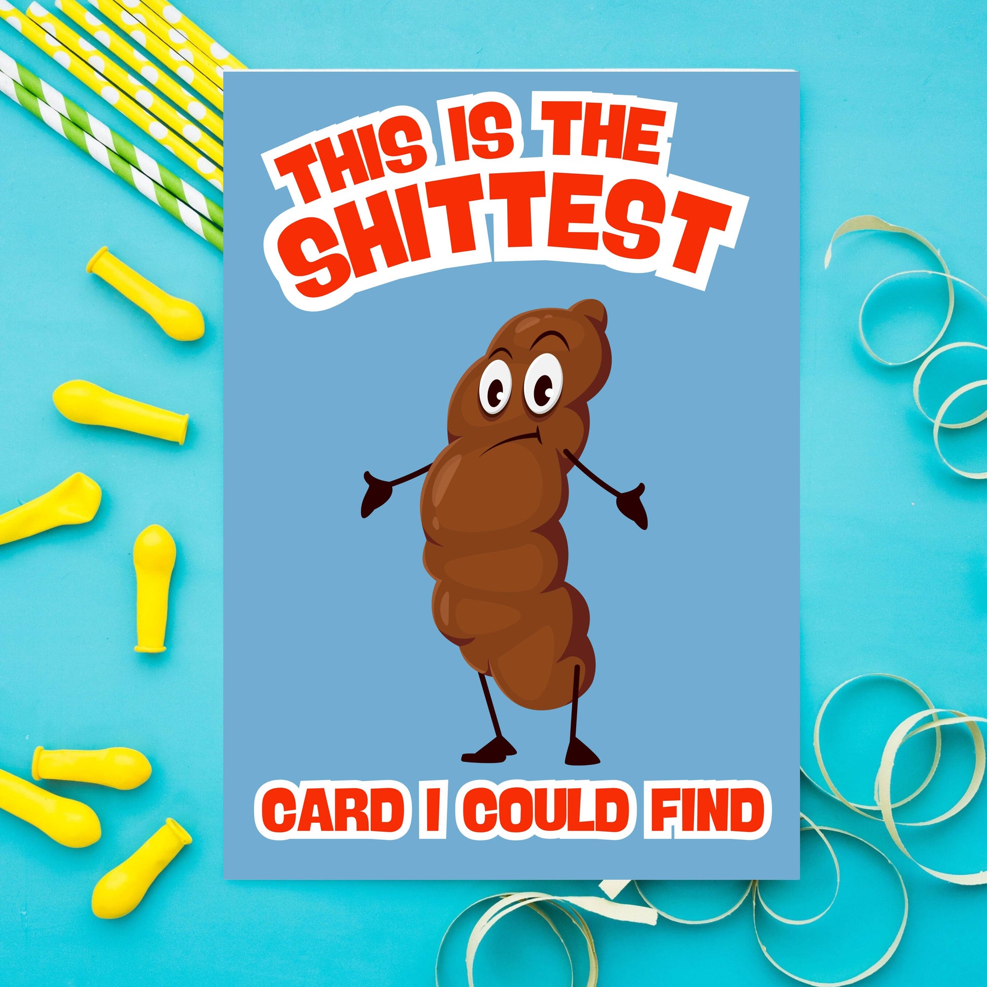 Card with cartoon poop character and humorous text on a blue background with party supplies.