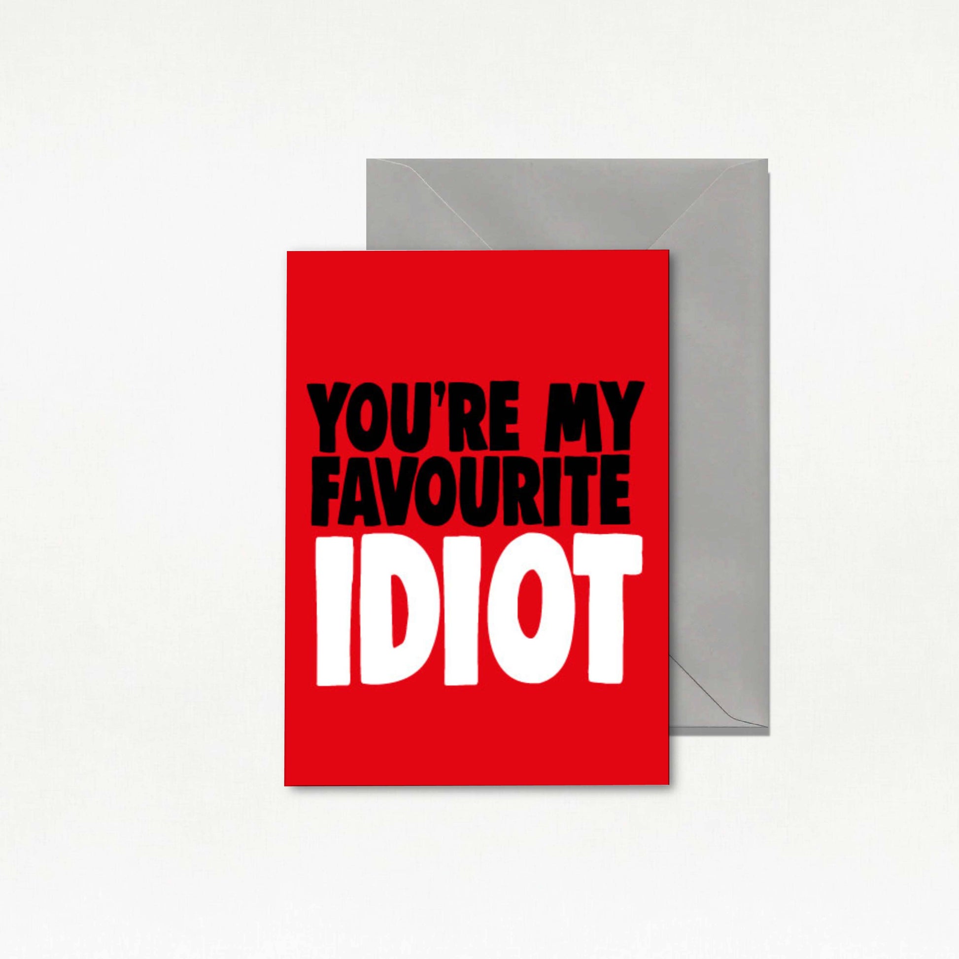 Red card with text 'You're my favourite idiot' and a gray envelope on a white background