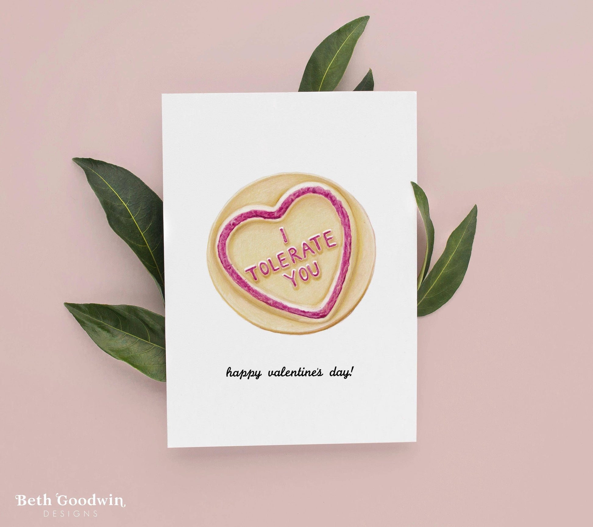 Valentine's Day card with a cookie graphic and text on a pink background