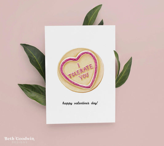 Valentine's Day card with a cookie graphic and text on a pink background