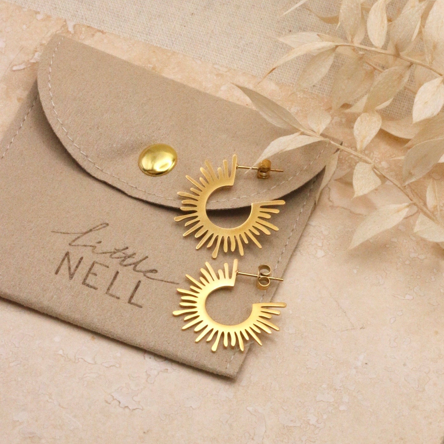 18 carat gold plated studs shaped to represent the suns rays.