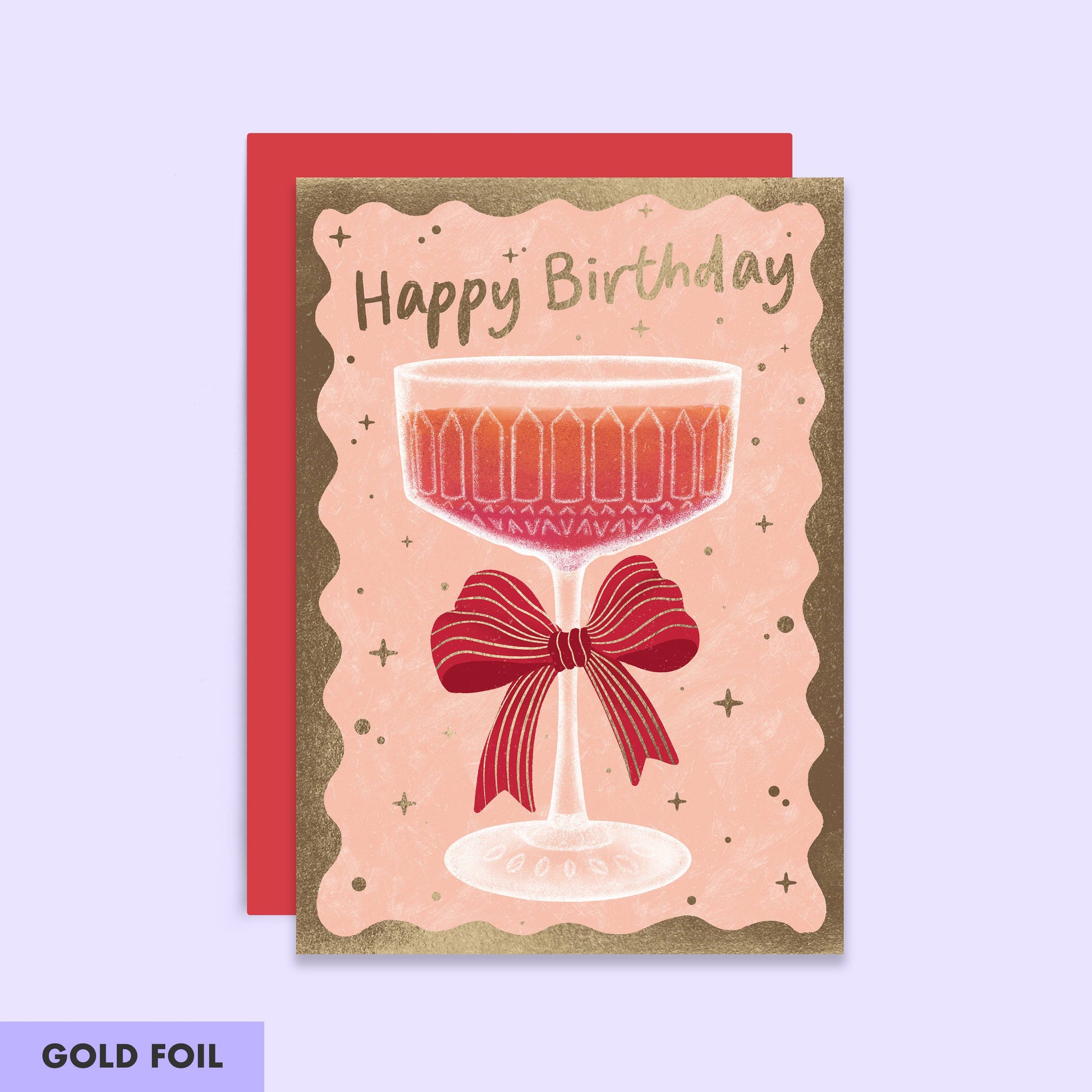 Birthday Card with a champagne coup with a bow attached.