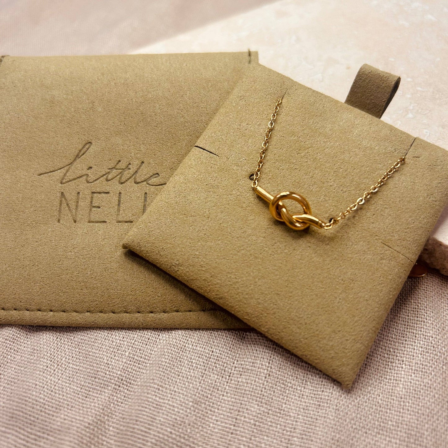 Gold plated simple knot detail chain necklace.