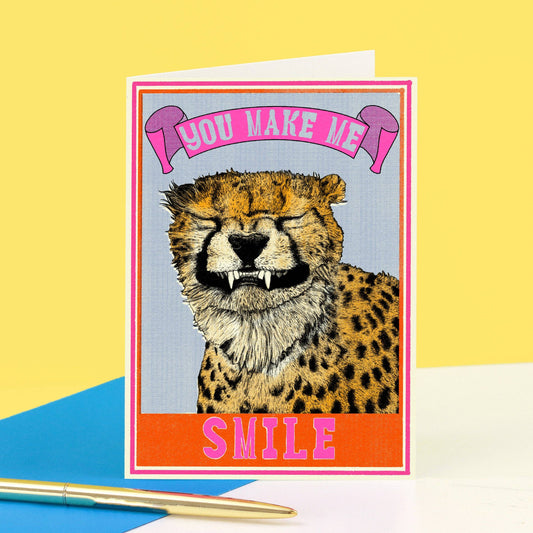 Grinning cheetah with the caption you make me smile.  Card is blank inside.