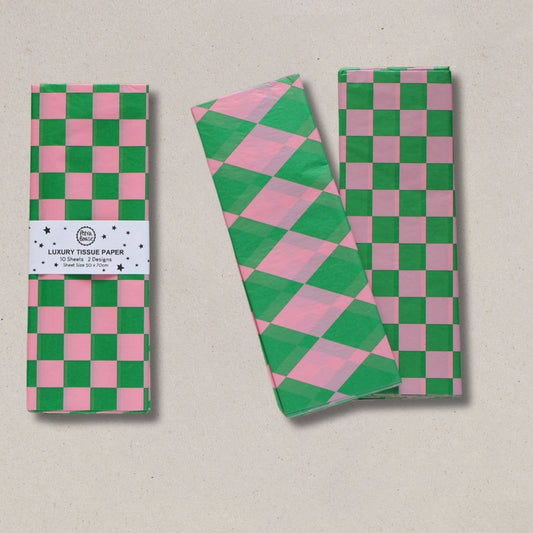 Green and pink checkered tissue paper with packaging on a beige background