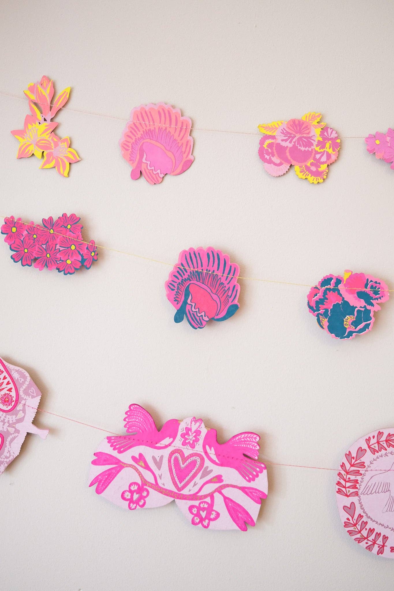 Colorful paper cutout decorations on a white background