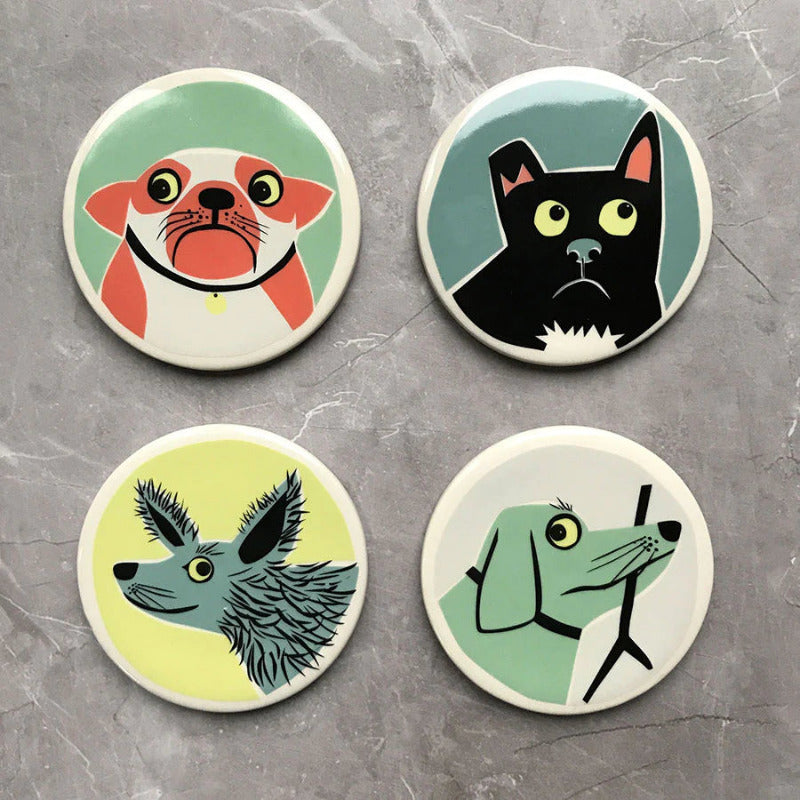 Set of four ceramic coasters with four different dog designs