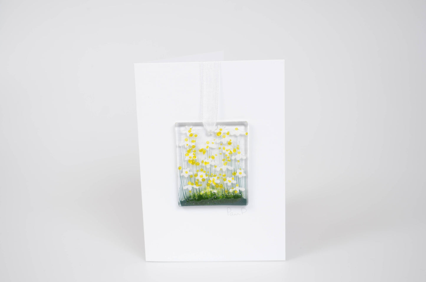 Glass panel with yellow flowers on a white background